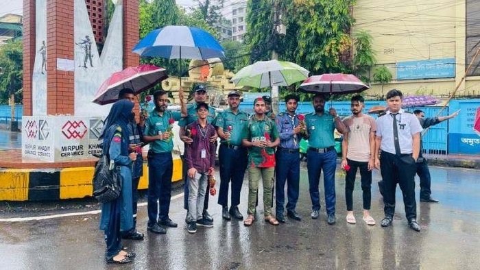 Students Wish Police Officials with Flowers on Duty