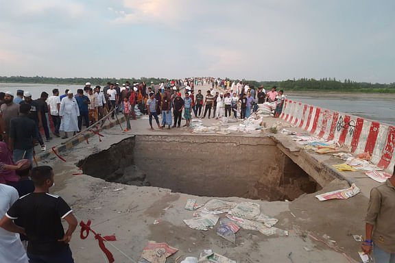 Two dead bodies were floating in the big Feni river, rescued and buried